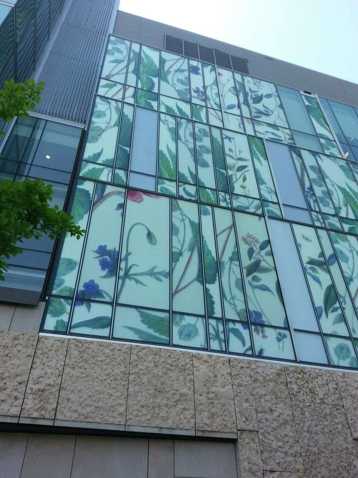 This undated publicity photo provided by American Bird Conservancy shows a bird-friendly design at the School of Pharmacy at the University of Waterloo that uses a variety of different materials in addition to glass, including panels depicting plants that are the sources of different drugs, in Ontario, Canada. (AP Photo/American Bird Conservancy, Christine Sheppard)