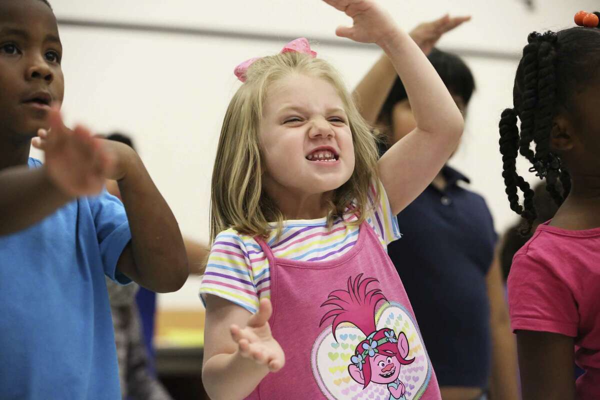 HISD Kinder Kamp student Josie Broadway, 5, is very excited to perform the songs they have learned in the past four weeks in the summer camp at Bastian Elementary School on Monday, July 2, 2018, in Houston. More than 30 students from pre-k and kindergarten present their visual arts achievements from Bastian Elementary, Alcott Elementary School and Young Elementary School performed. ( Yi-Chin Lee / Houston Chronicle )