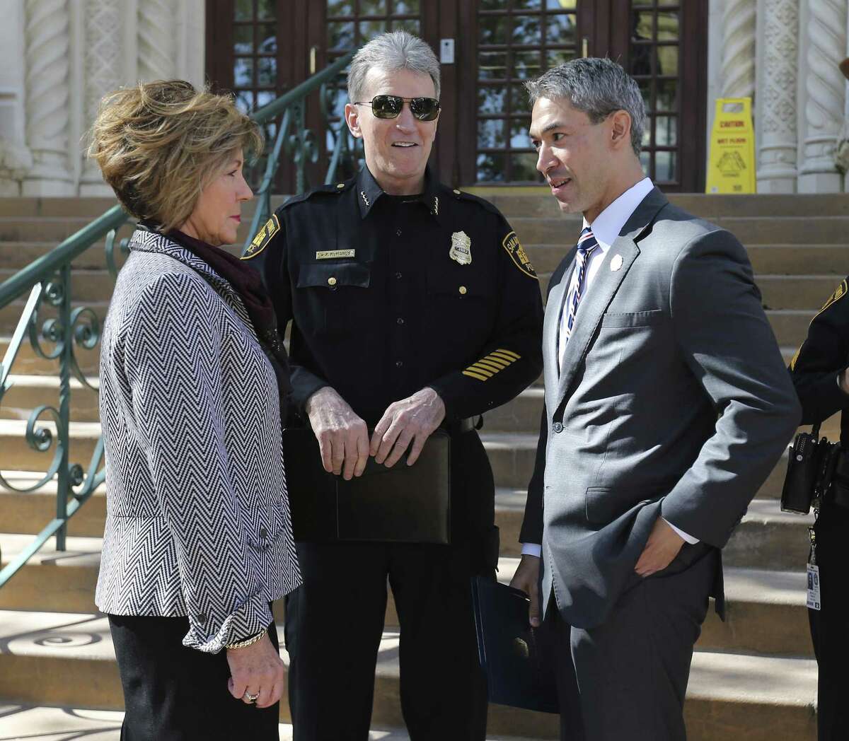 City Manager Sheryl Sculley (left) and Mayor Ron Nirenberg (right) meet with San Antonio Police Chief William McManus before a press conference to raise awareness of human trafficking on the steps of City Hall on Thursday, Jan. 11, 2018. Nirenberg was quick to voice support for McManus who has become embroiled in a investigation concerning the release of immigrants in a human smuggling case which occurred on December 23. District 6 Councilman Greg Brockhouse sent a letter to the U.S. Attorney General's Office to investigate the handling of human smuggling incident by San Antonio Police. McManus has maintained that the department and his officers abided by proper procedure and had no jurisdiction to hold the immigrants which were released to the Refugee and Immigration Center for Education and Legal Services (RAICES) and Catholic Charities. (Kin Man Hui/San Antonio Express-News)