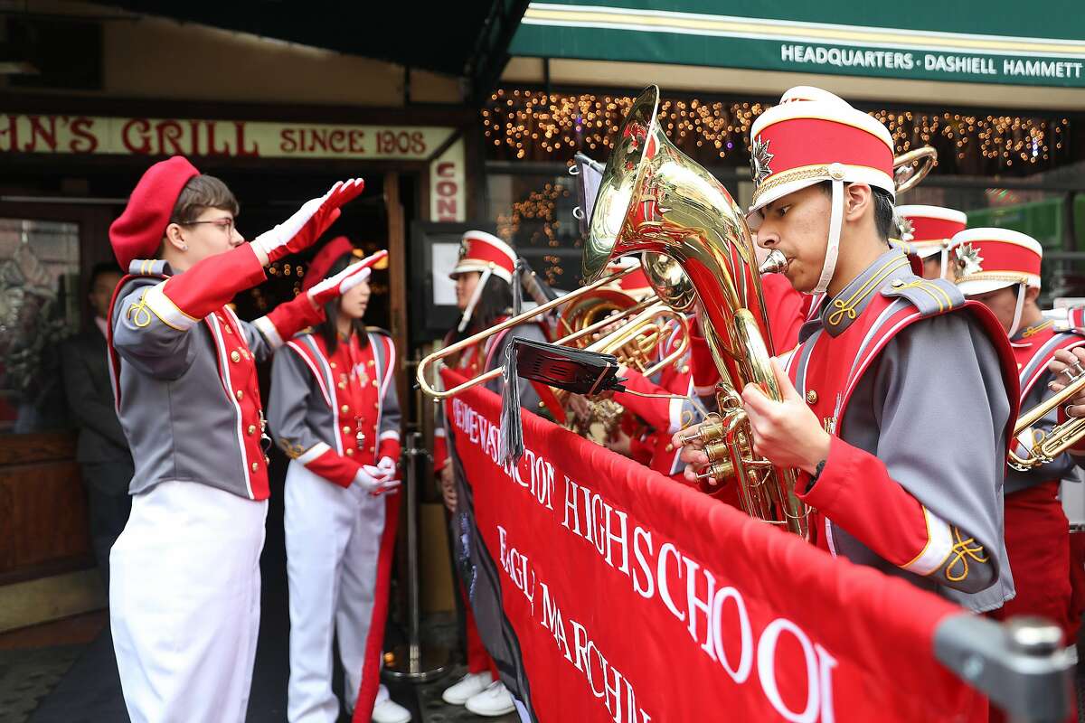 The George Washington High School marching band performs in front of John's Grill as it celebrates its 110th anniversary on Thursday, Nov. 29, 2018, in San Francisco, Calif.