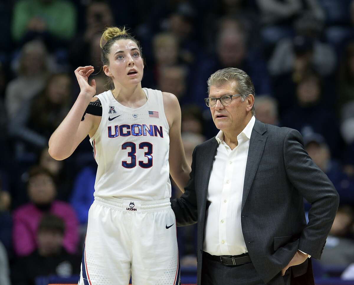 Connecticut's Katie Lou Samuelson (33) talks to head coach Geno Auriemma in the second half of a women's NCAA college basketball game against Ohio State, Sunday, Nov. 11, 2018, in Storrs, Conn. (AP Photo/Stephen Dunn)