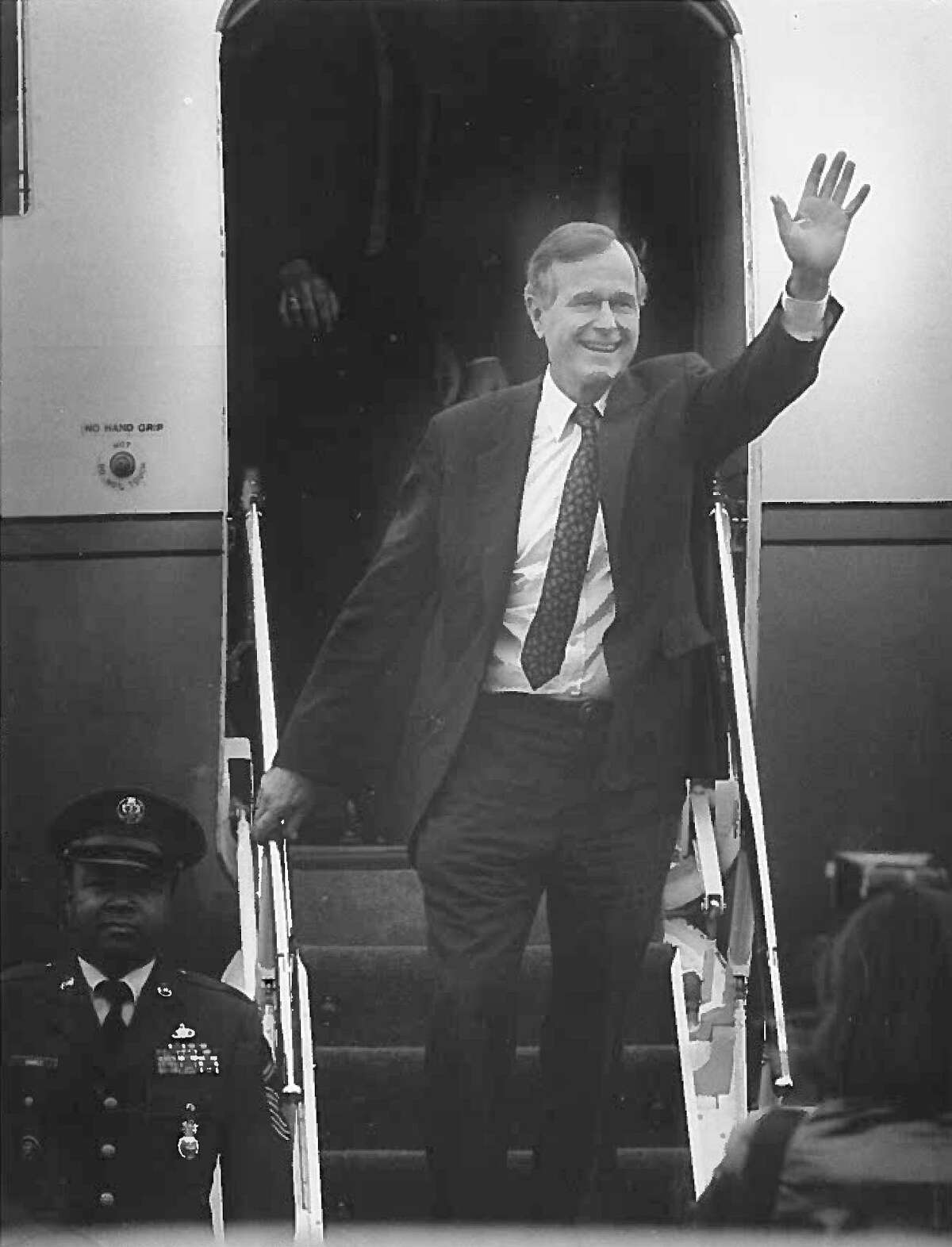 Pres. George H.W. Bush waves to small crowd gathered at Westchester Co. Airport before going to his mother's home in Greenwich on Nov. 5, 1989.