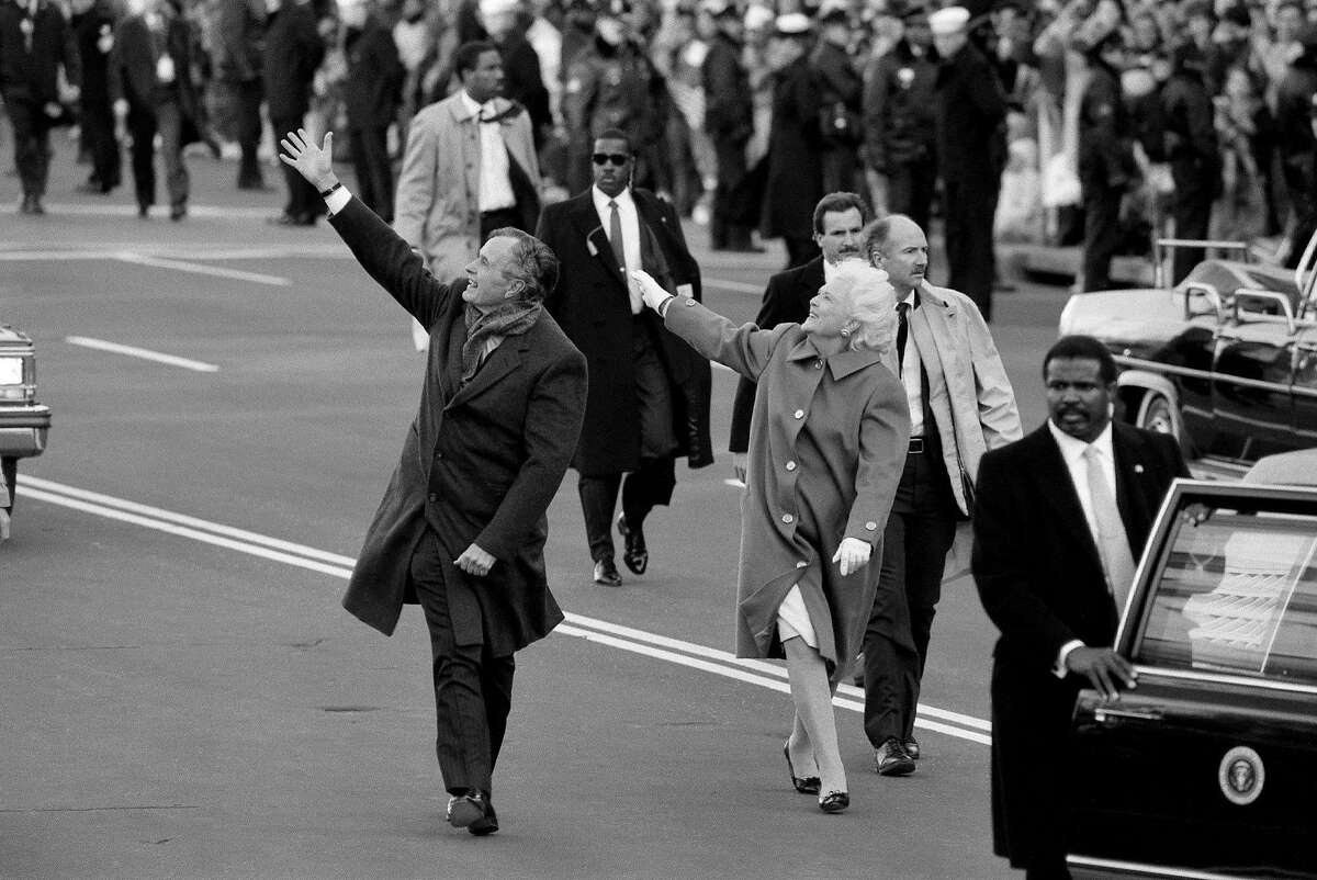 FILE � President George H.W. Bush and first lady Barbara Bush wave to the crowds on Inauguration Day in Washington, Jan. 20, 1989. Bush, the 41st president of the United States and the father of the 43rd, who steered the nation through a tumultuous period in world affairs but was denied a second term after support for his presidency collapsed under the weight of an economic downturn and his seeming inattention to domestic affairs, died on Nov. 30, 2018. He was 94. (Jose R. Lopez/The New York Times)