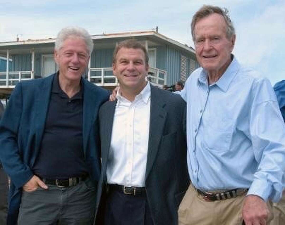 Tilman J. Fertitta, Chairman, CEO and sole owner of Landry’s, and Houston Rockets "We went to see Bill Clinton and Clinton was “the evil” one listening to all of his advisers. I’d gotten to know Bill Clinton and said to H. W., 'This is a guy who loves the country just like you.'Then when “43” [President George W. Bush] asked H.W and Clinton to raise money together [for the Clinton Bush Haiti Fund], they continued to bond their friendship. The Bush family and the Clintons are very close today." Pictured: Former President Bill Clinton, Tilman Fertitta, and Former President George H. W. Bush on the beach in Galveston after Hurricane Ike.