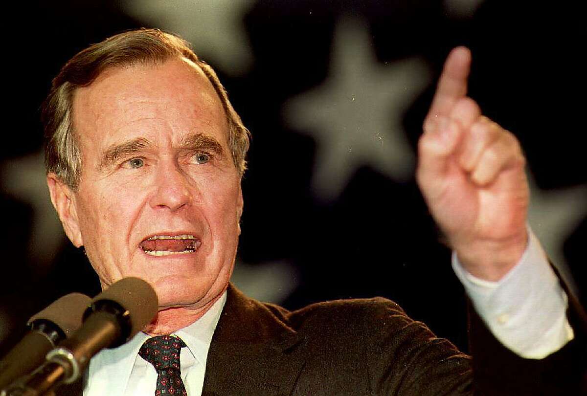 (FILES) In this file photo taken on October 31, 1992 US President George Bush speaks 01 November 1992 to a large group of supporters during a campaign stop at the Sikorsky Memorial Airport in Connecticut. - Former US president George H.W. Bush, who helped steer America through the end of the Cold War, has died at age 94, his family announced late Friday November 30, 2018. "Jeb, Neil, Marvin, Doro and I are saddened to announce that after 94 remarkable years, our dear Dad has died," his son, former president George W. Bush, said in a statement released on Twitter by a family spokesman. (Photo by J. David AKE / AFP)J. DAVID AKE/AFP/Getty Images