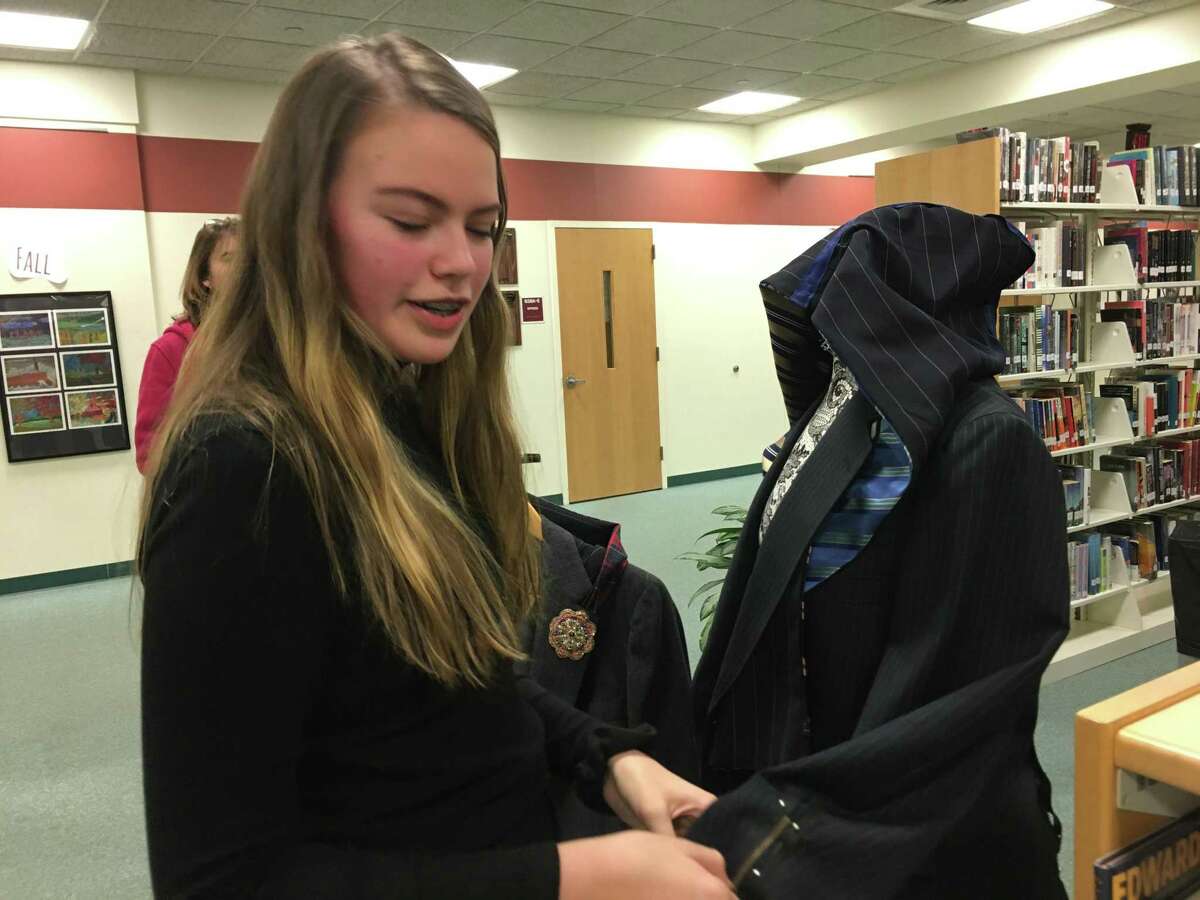 Adeline Hawley, a freshman in the GHS Innovation Lab, shows off her passion project. Sewed a hooded suit jacket made from a reclaimed blazer and ties to show how to reuse clothing. Her research showed the negative environmental impact of the modern fashion industry, which manufactures cheap clothing to be purchased often.