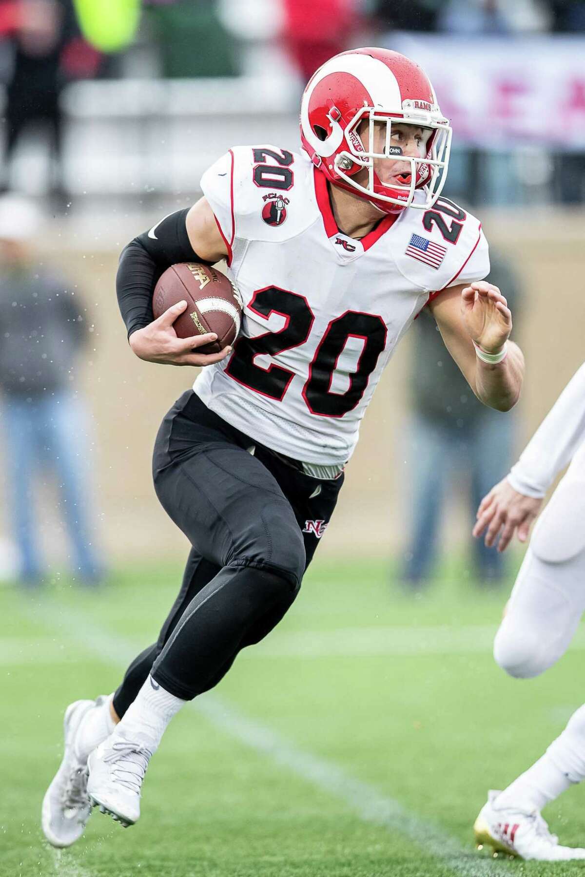 Quintin O'Connell (20) of New Canaan runs with the ball after a reception during a football game between New Canaan and Fairfield Prep on December 2, 2018 at Fairfield University in Fairfield, CT.