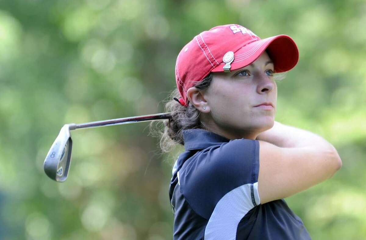 Jen Tierney watches her ball Sunday during the Danbury Amateur golf championship at Richter Park, July 18, 2010.