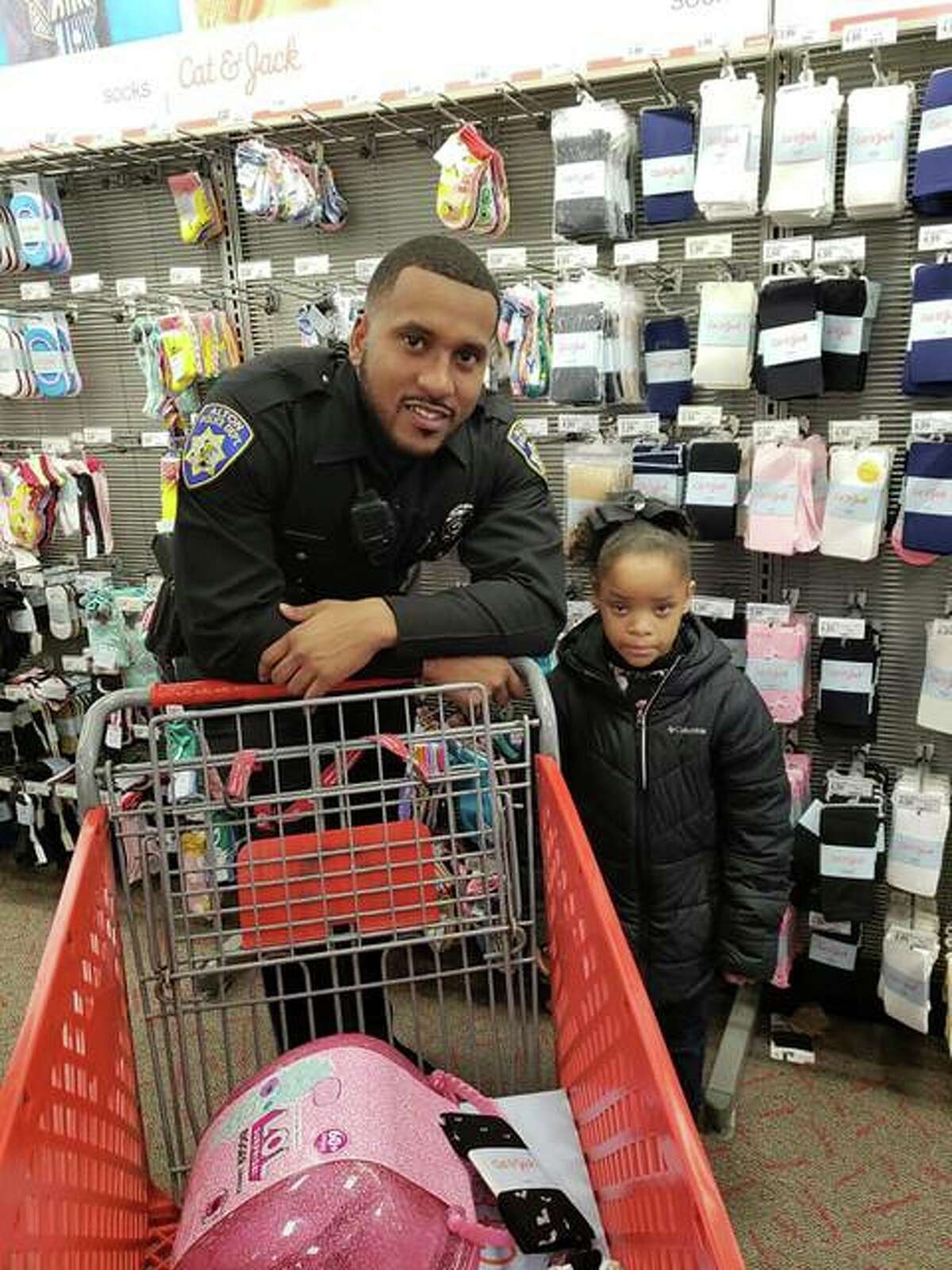 Alton Police Department probationary patrol officer Shawn Middlebrook shops with a young Alton School District student Saturday during the Police Benevolent and Protective Association (PB&PA) Alton Unit 14’s annual Shop With A Cop outreach event.