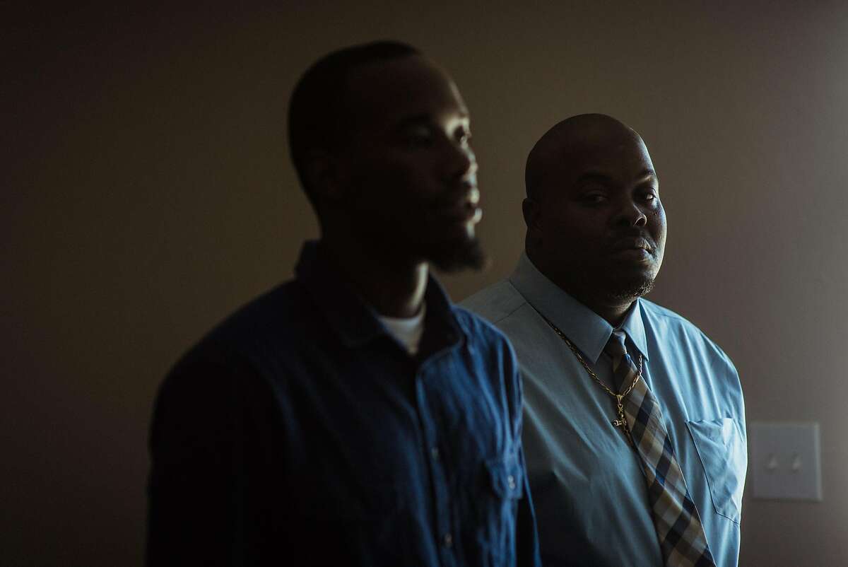 Demetric Diaz, left, who says he heard racial slurs directed towards him while working for the Tesla factory in Fremont, Calif., at his home with his his father, Owen Diaz, in Vallejo, Calif., Sept. 10, 2018. African-American workers have reported threats, humiliation and barriers to promotion at Tesla, while the automaker says there is no pattern of bias. (Ryan Christopher Jones/The New York Times)