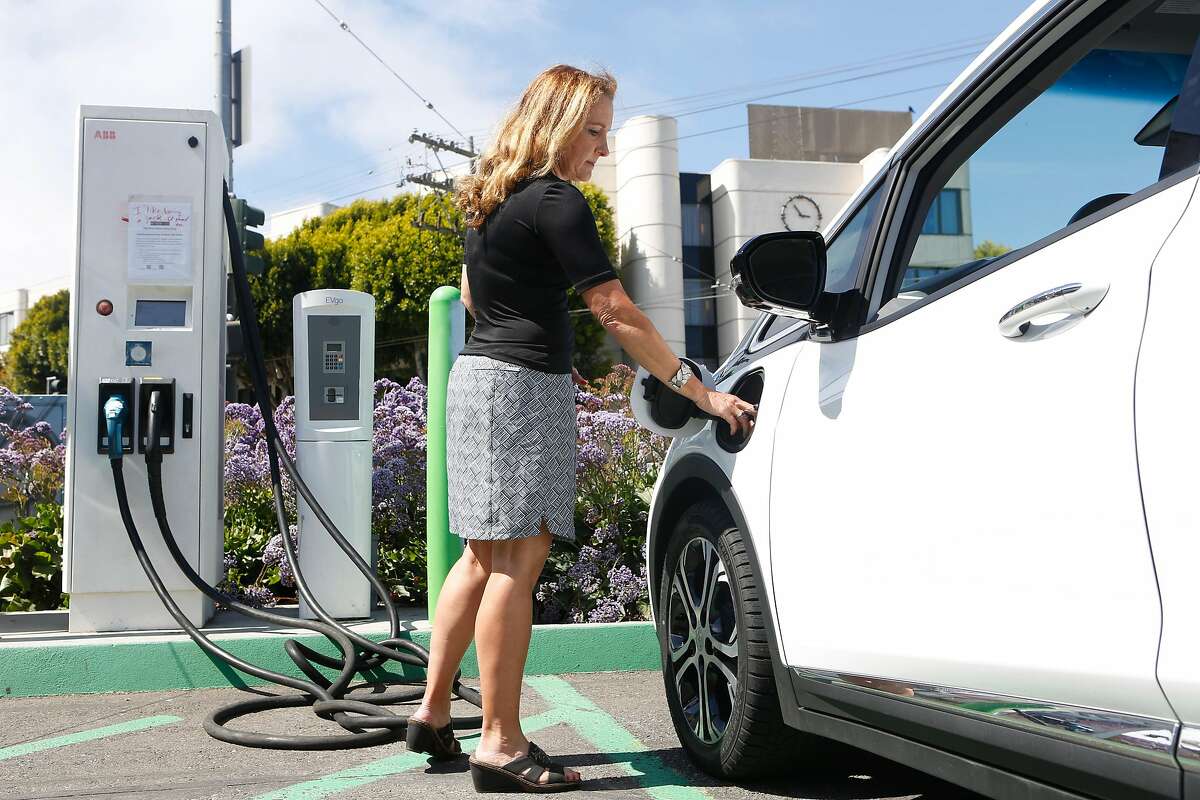 Esther M. de Frutos, an Uber driver of one year, prepares to charge her Chevy Bolt EV electric car at a Walgreens on Monday, June 18, 2018 in San Francisco, Calif.