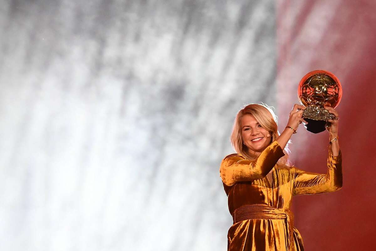 Olympique Lyonnais' Norwegian forward Ada Hegerberg brandishes her trophy after receiving the 2018 FIFA Women's Ballon d'Or award for best player of the year during the 2018 FIFA Ballon d'Or award ceremony at the Grand Palais in Paris on December 3, 2018. - The winner of the 2018 Ballon d'Or will be revealed at a glittering ceremony in Paris on December 3 evening, with Croatia's Luka Modric and a host of French World Cup winners all hoping to finally end the 10-year duopoly of Cristiano Ronaldo and Lionel Messi. (Photo by FRANCK FIFE / AFP)FRANCK FIFE/AFP/Getty Images