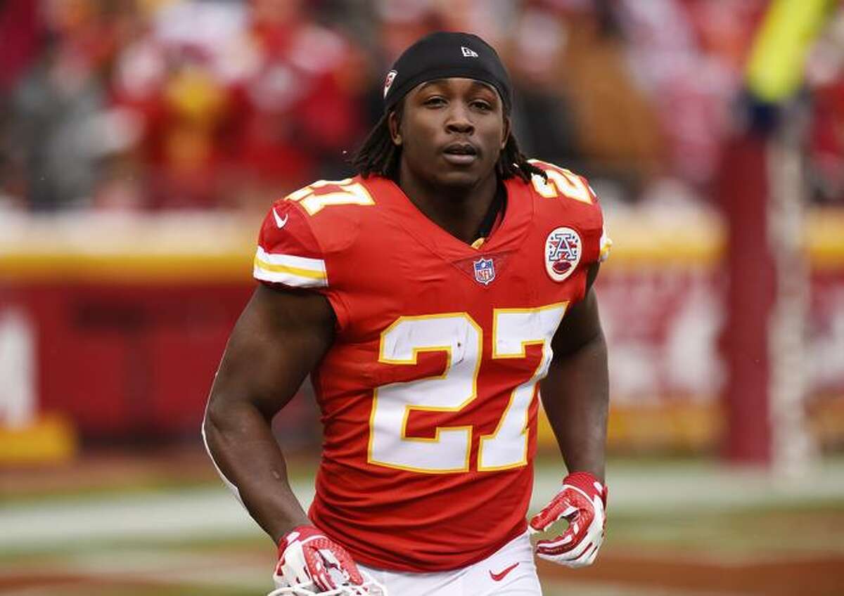 Running back Kareem Hunt #27 of the Kansas City Chiefs runs to the sidelines just before kickoff in the game against the Miami Dolphins at Arrowhead Stadium on December 24, 2017 in Kansas City, Missouri.