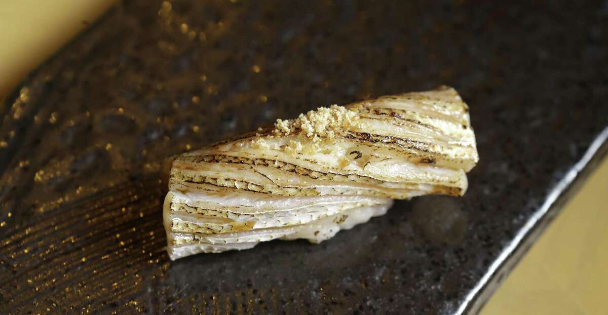 Skin-on kamasu (Japanese Barracuda) with sesame seeds at Tobiuo Sushi & Bar