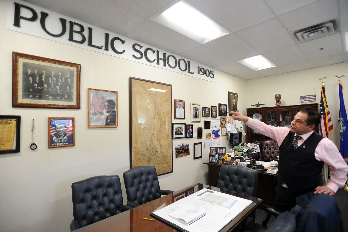 Ansonia Mayor David Cassetti displays the copper lettering from Peck School in his City Hall office in Ansonia, Conn. on Wednesday, February 28, 2018.