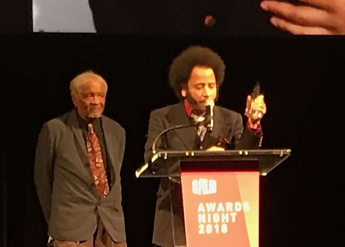 Director Boots Riley accepts award from Ishmael Reed at SFFilm Gala