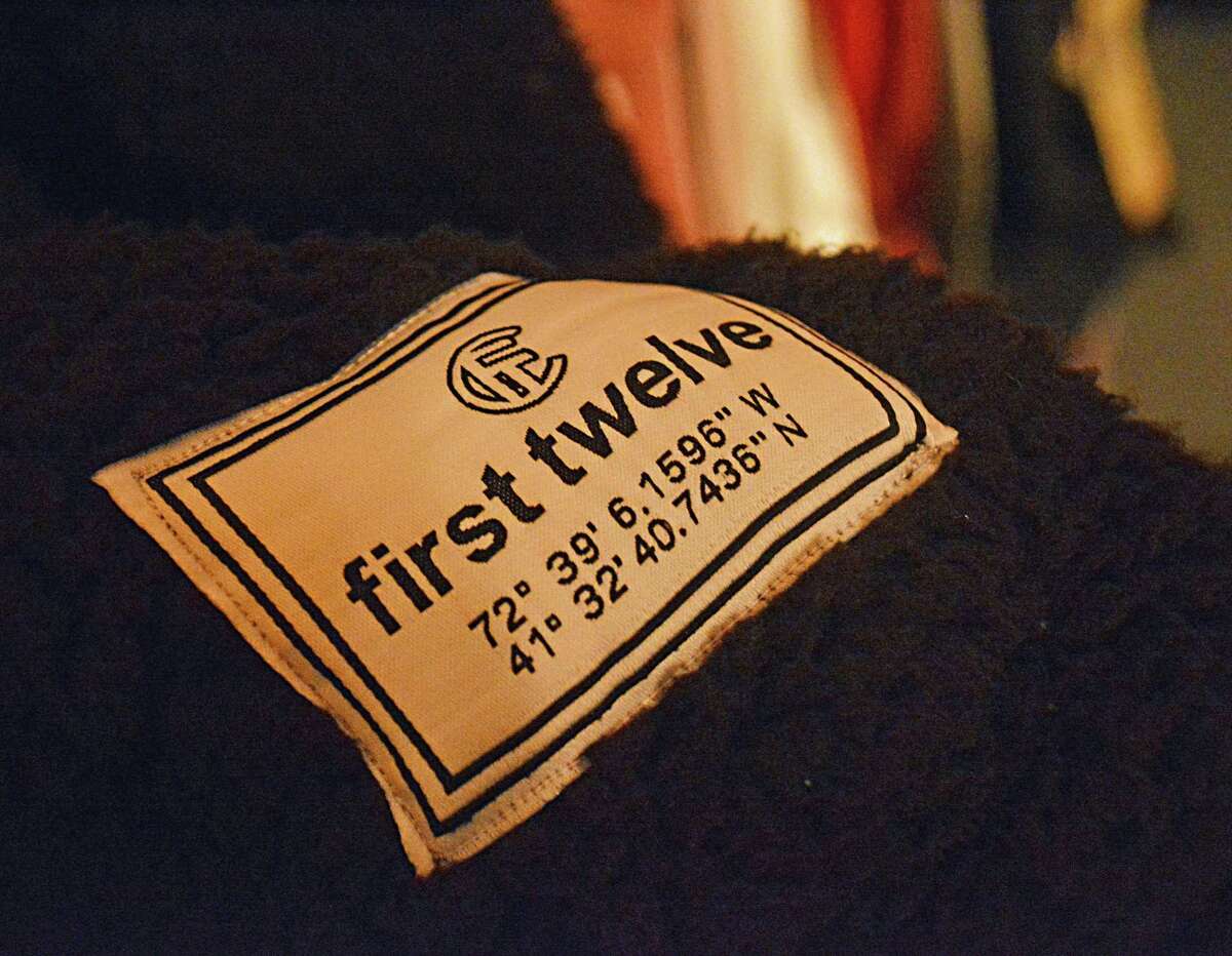 Every year or season, First Twelve comes out with new clothing labels. This one, found on a soft and fuzzy sherpa hoodie, gives the geographical coordinates of the shop — in a nod to sailing navigation.