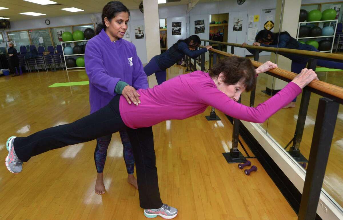 Instructor and Trainer Suma Iyer instructs Wilton residents Fran Schmale during a Barre Class at the Riverbrook Regional Tuesday, December 4, 2018, in Wilton, Conn. The city of Norwalk has received a proposal from Riverbook Regional YMCA to operate the South Norwalk Community Center at 98 South Main St.