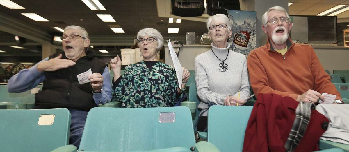 Linda and Rod Greenwood, left, and Dave and Sue Weber react to the greyhounds they bet on during the fifth race of the first night of live racing since 2015 at Gulf Greyhound Park on Thursday, Jan. 4, 2018, in La Marque. The Greenwoods won a small bet on this race.