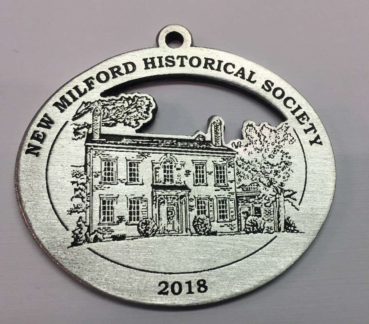 The New Milford Historical Society & Museum is selling its 2018 medallion, which features the John Glover Noble House in town.