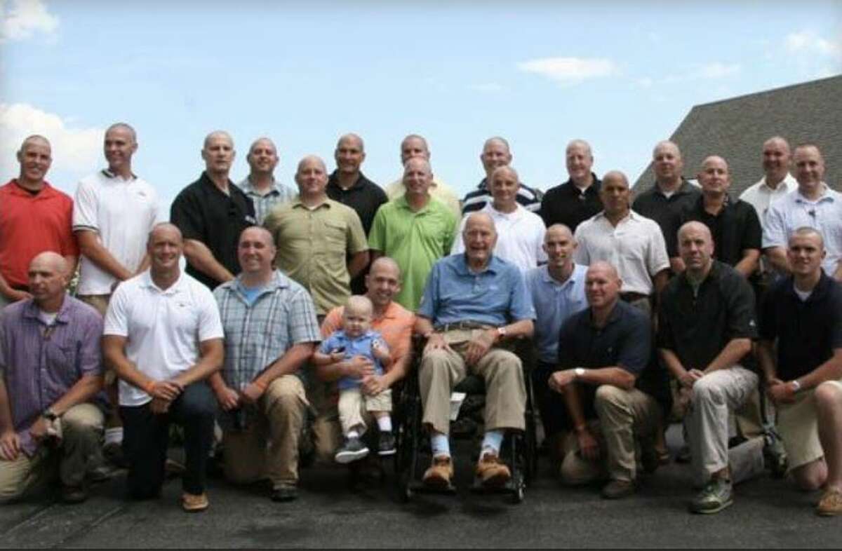 The members of the former president's Secret Service detail also shaved their heads in support of the son of a member of the team who had leukemia.