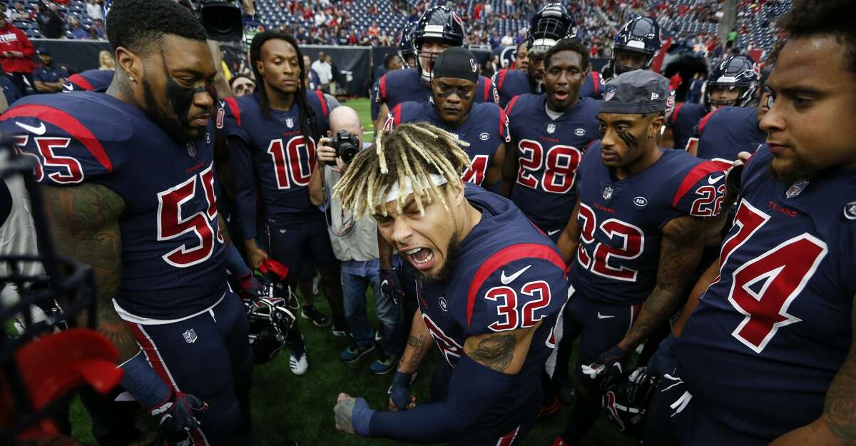 Houston Texans free safety Tyrann Mathieu (32) gathers his teammate together before an NFL football game against the Cleveland Browns at NRG Stadium on Sunday, Dec. 2, 2018, in Houston.