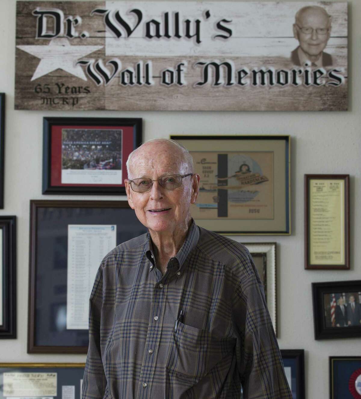 Montgomery County Republican Party Chairman Wally Wilkerson poses for a portrait in front of his wall of memories from more than 50 years as chairman at the Montgomery County Republican Headquarters, Wednesday, Dec. 5, 2018, in Conroe.
