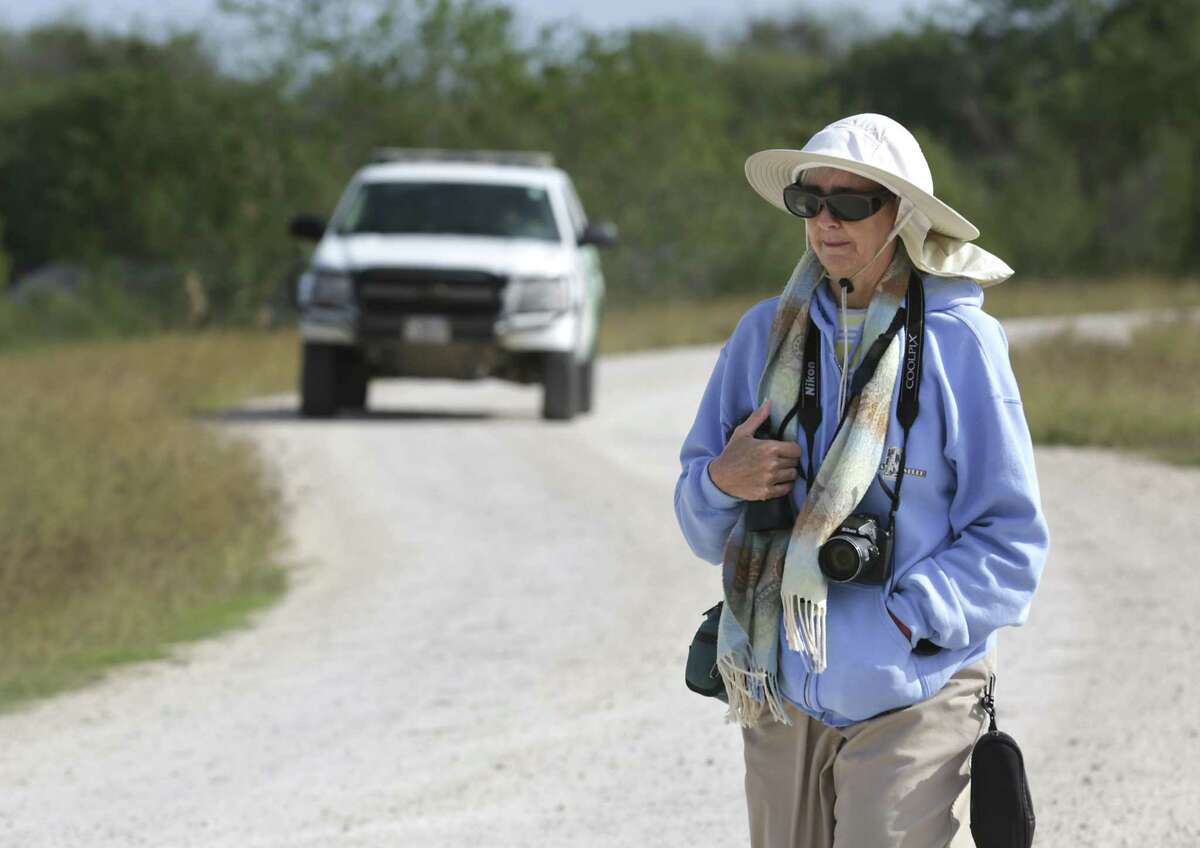 Mission resident Joanne Mozynski, an avid birder, looks for the Roadside Hawk that was seen recently along the levee at the National Butterfly Center. A Border Patrol vehicle behind her patrols along the levee. Border wall plans would cut The National Butterfly Center in half. The first signs of border wall construction were spotted this weekend at National Butterfly Center.