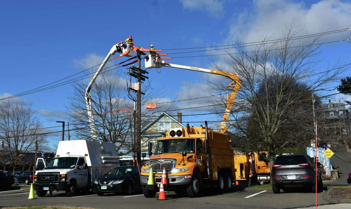 Eversource technicians work on lines in early December 2018 in Norwalk, Conn.