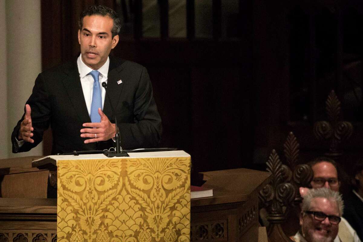 Thousands line train tracks to watch Bush funeral train to College Station