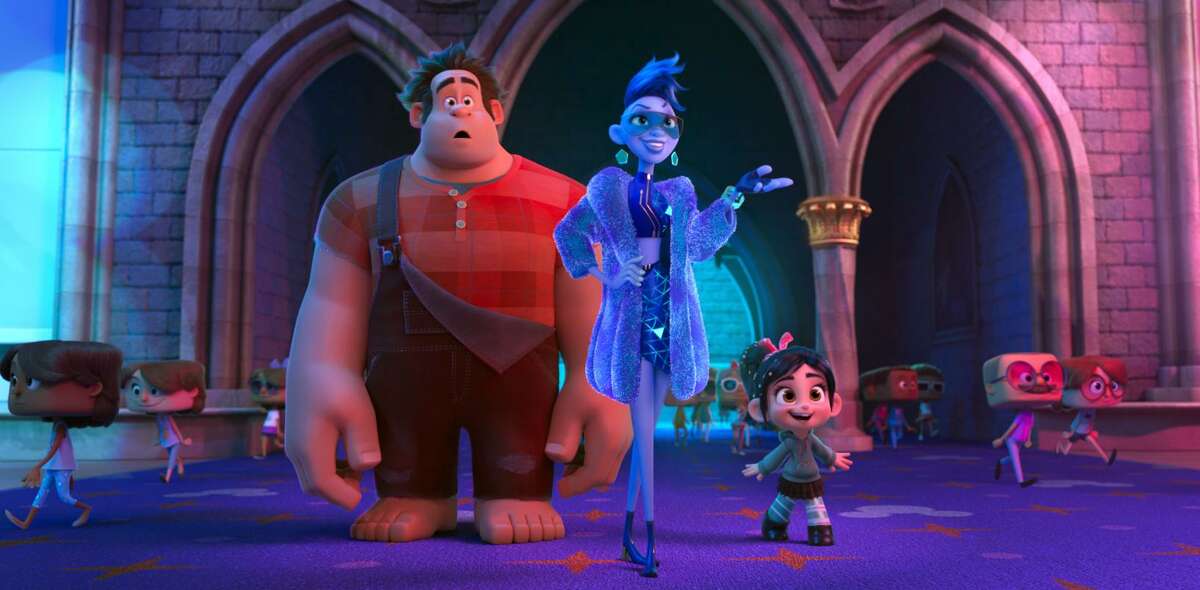 This image released by Disney shows characters, from left, Ralph, voiced by John C. Reilly; Yess, voiced by Taraji P. Henson and Vanellope von Schweetz, voiced by Sarah Silverman in a scene from