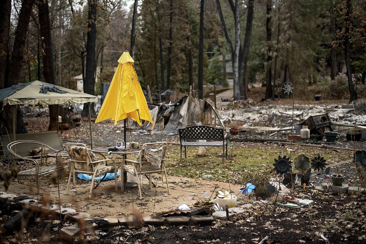 Following the Camp Fire, a patio umbrella stands among the wreckage of a Magalia, Calif., home on Tuesday, Dec. 4, 2018. (AP Photo/Noah Berger)
