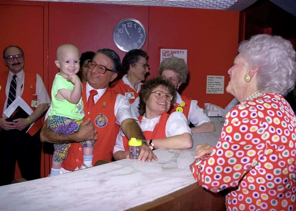 Gene Macy with Barbara Bush at Texas Children’s Hospital in 1991.