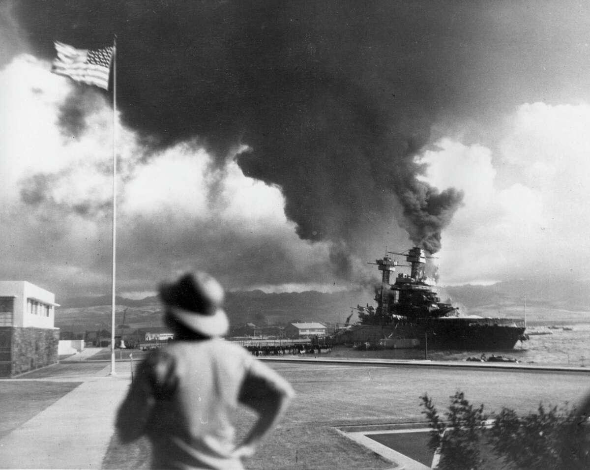 American ships burn during the Japanese attack on Pearl Harbor, Hawaii, in this Dec. 7, 1941 file photo. (AP Photo/File)
