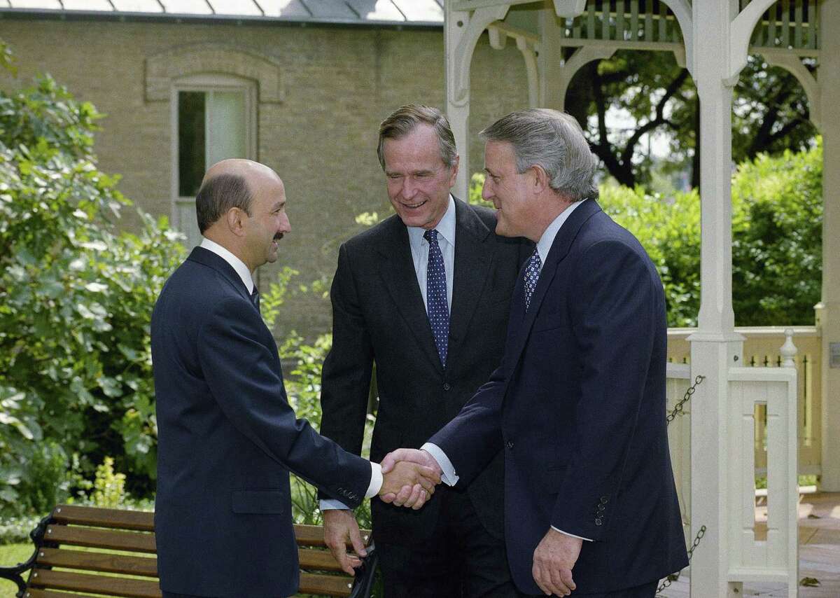 Mexican President Carlos Salinas de Gortari, left, greets Canadian Prime Minister Brian Mulroney, right, and U.S. President George Bush, Oct. 7, 1992 in San Antonio, Texas. The leaders are scheduled to initial the North American Free Trade Agreement that would create the world?’s largest trading bloc, with a combined economic output of $6 trillion. (AP Photo/Marcy Nighswander)