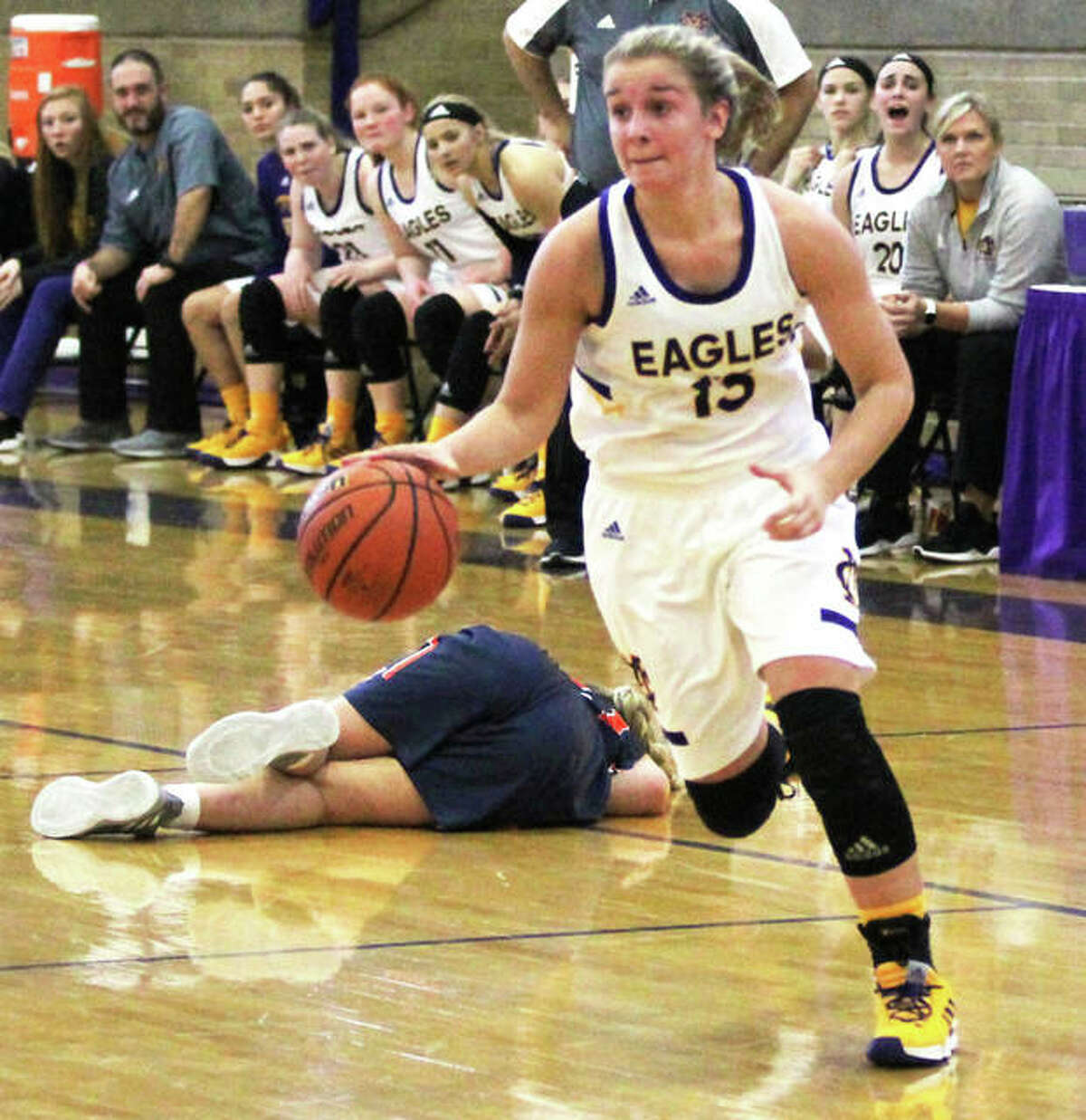 CM’s Harper Buhs, shown heading to the basket after stealing the basketball from fallen Rochester Rocket on Nov. 24 at the Taylorville Tourney, scored seven points Thursday night in the unbeaten Eagles’ 40-39 victory over Breese Mater Dei in Bethalto.