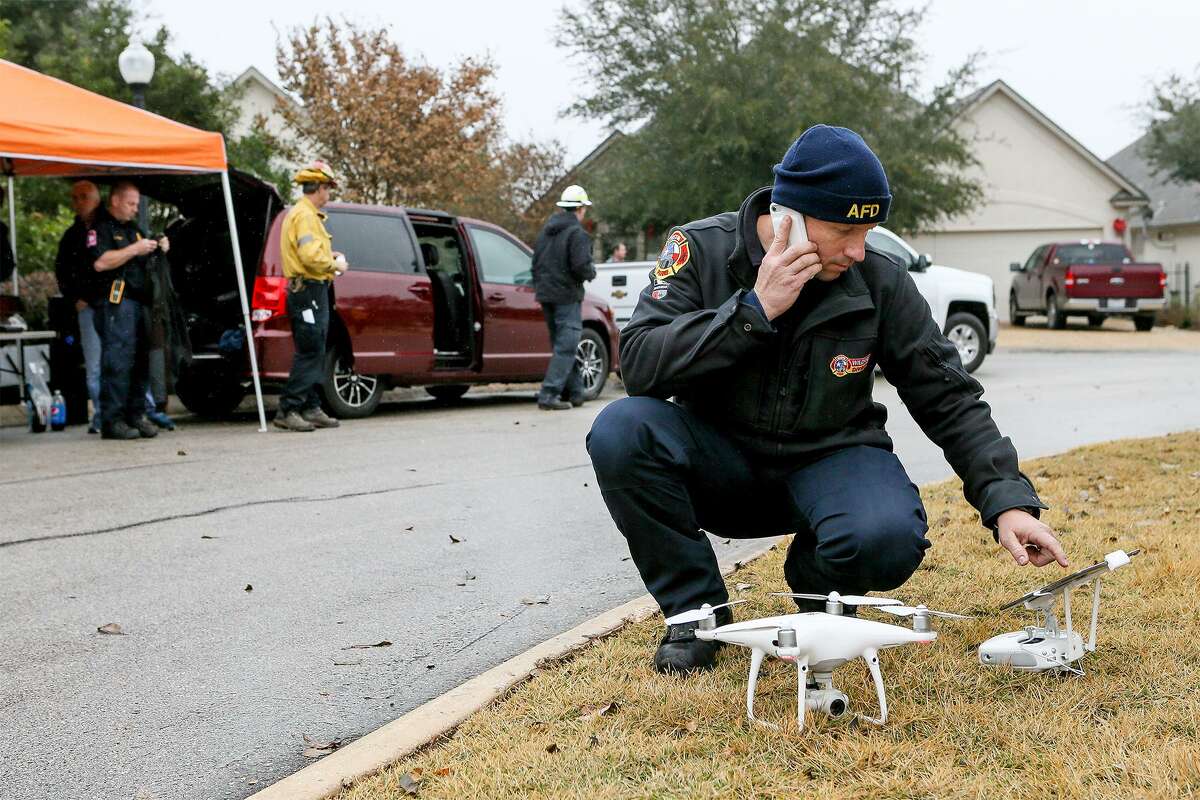 Coitt Kessler with the Austin Fire Department sets up a drone Thursday, Dec. 6, 2018 to oversee a wildfire training exercise in the Roseheart neighborhood on the North Side. Sixty San Antonio firefighters participated in the national training after completing 32 hours of classroom training.