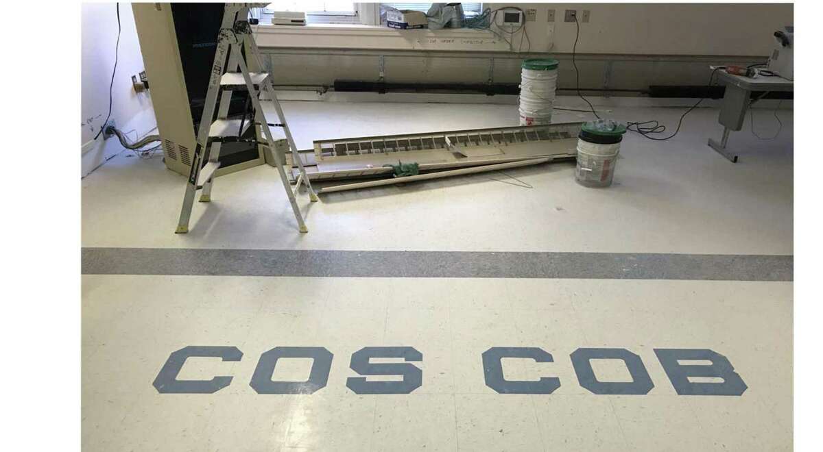 Repair works continues after a flood at Cos Cob School.