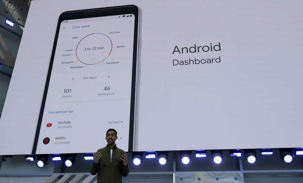 Google CEO Sundar Pichai speaks in May 2018 in Mountain View, Calif., with a display of a Google Android smartphone as a backdrop. In 2017, the cost of mobile phone service dropped by the biggest margin on record, according to new estimates published in December 2018 by the Federal Communications Commission. (AP Photo/Jeff Chiu, File)