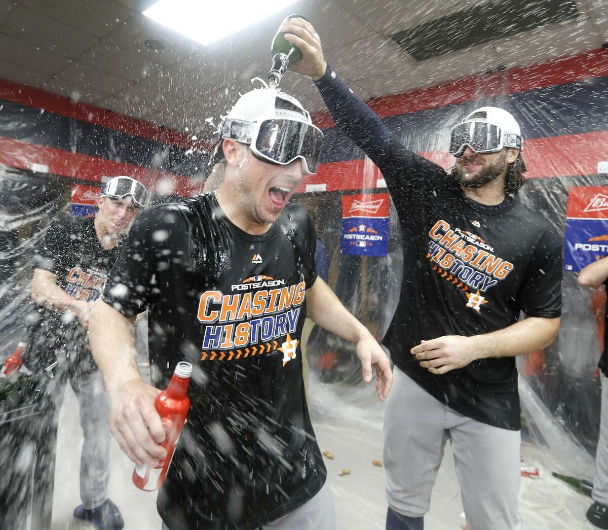 Houston Astros Jake Marisnick celebrates with Alex Bregman in the locker room as the Houston Astros celebrated their clinch over Cleveland Indians during the ALDS Game 3 at Progressive Field, October 8, 2018, in Cleveland.