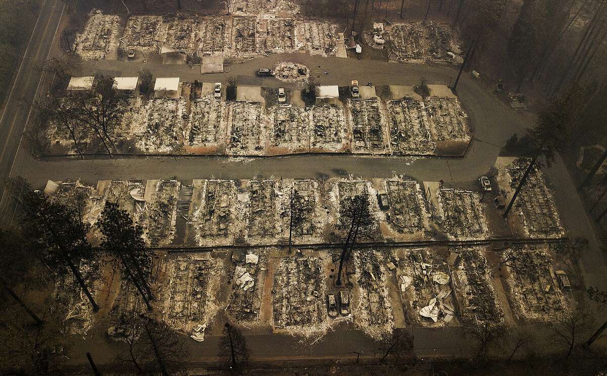 Ashes and debris are all that remain where houses once stood in Paradise, Calif., on Nov. 15, 2018, after a wildfire destroyed the town. (AP Photo/Noah Berger)
