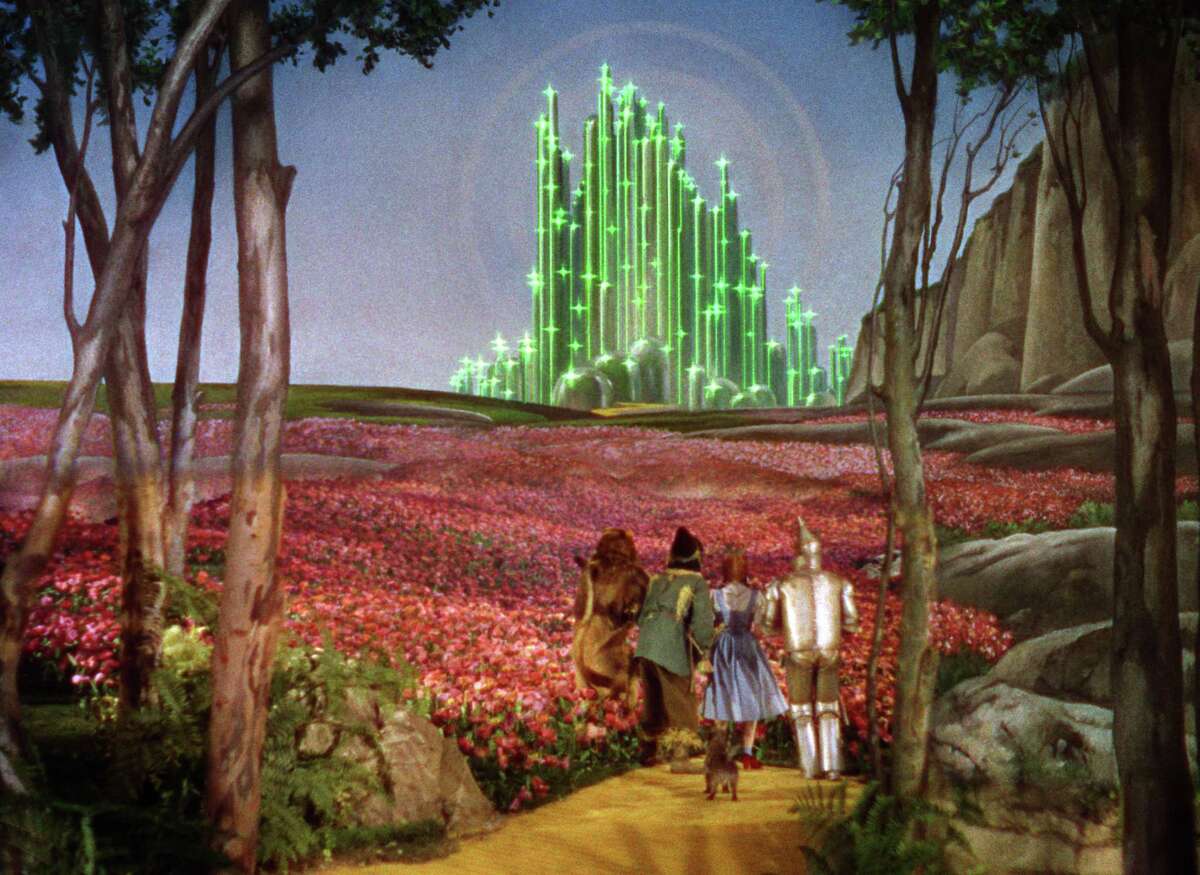 Dorothy, the Scarecrow, the Lion, and the Tin Man make their way to the Emerald City in “The Wizard of Oz.”
