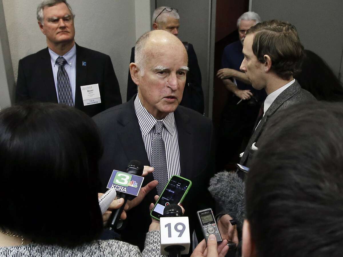California Gov. Jerry Brown talks to reporters after speaking at the Association of California Water Agencies conference, Thursday, Jan. 14, 2016, in Sacramento, Calif. Brown continued his call to build a $15 billion twin tunnel system to move water through the Sacramento-San Joaquin Delta. (AP Photo/Rich Pedroncelli)