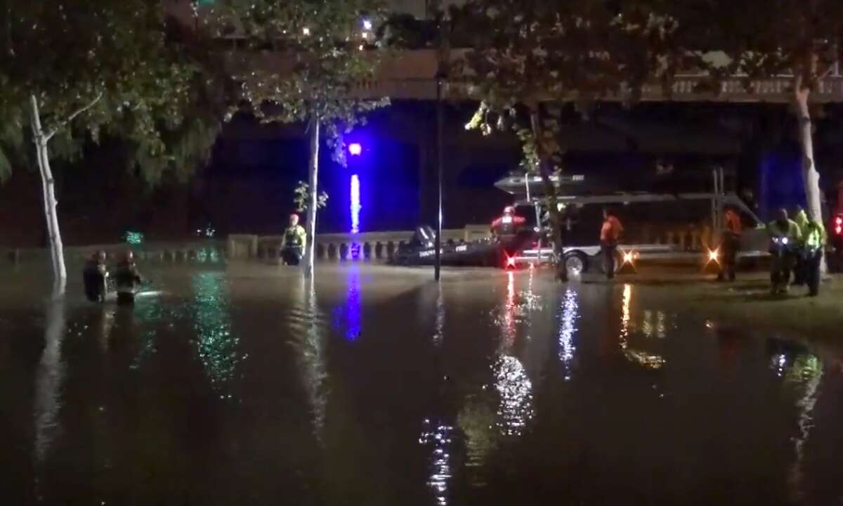 Houston firefighters responded to an SUV stuck in floodwaters in Sesquicentennial Park late Friday, Dec. 7, 2018. No one was found inside the vehicle.