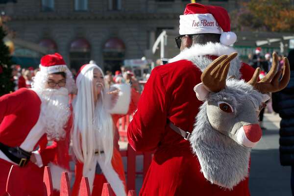 santas elves fill union square for 24th annual santacon sfchronicle com santas elves fill union square for