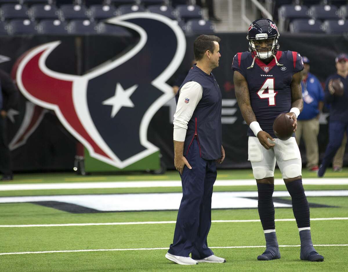 Houston Texans quarterbacks coach Sean Ryan talks to quarterback Deshaun Watson before an NFL football game against the Indianapolis Colts at NRG Stadium on Sunday, Dec. 9, 2018, in Houston.