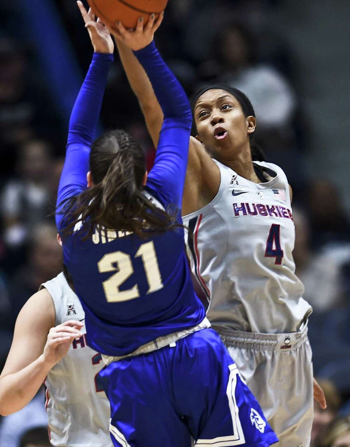 Connecticut’s Mikayla Coombs (4) blocks a shot against Seton Hall’s Nicole Jimenez (21) in the second half on Saturday in Hartford. UConn won 99-61.