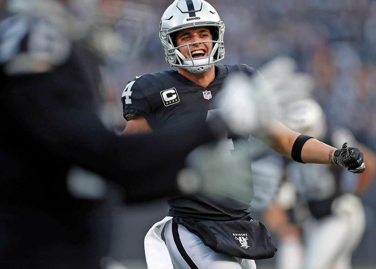 Oakland Raiders' Derek Carr celebrates touchdown reception by Lee Smith in 4th quarter of Raiders' 24-21 win over Pittsburgh Steelers in NFL game at Oakland Coliseum in Oakland, Calif. on Sunday, December 9, 2018.