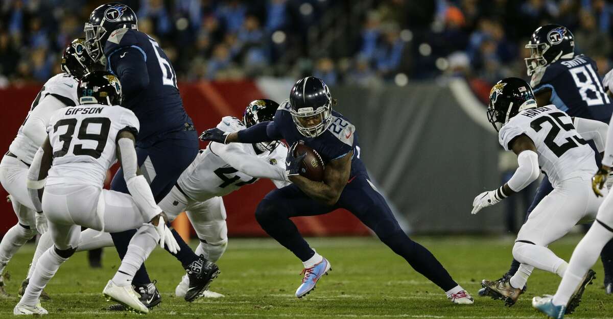 NASHVILLE, TN - DECEMBER 6: Derrick Henry #22 of the Tennessee Titans runs downfield with the ball against the Jacksonville Jaguars during the fourth quarter at Nissan Stadium on December 6, 2018 in Nashville, Tennessee. (Photo by Silas Walker/Getty Images)