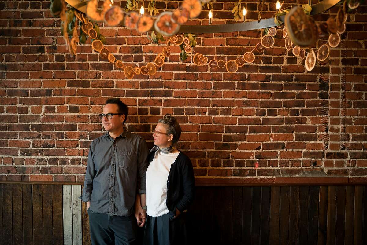 Russell Moore and Allison Hopelain stand for a photo inside of Camino restaurant in Oakland, Calif., on Friday, Dec. 7, 2018. Moore and Hopelain have been co-owners of Camino for over ten years.
